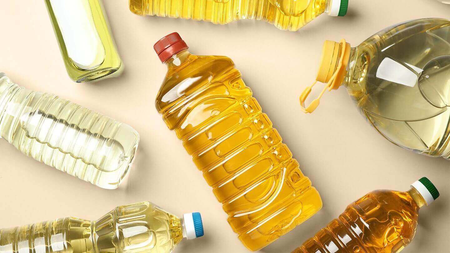 Seed oils in real life: What to avoid, what to use, and why it matters - various bottles of seed oils on a flat surface.