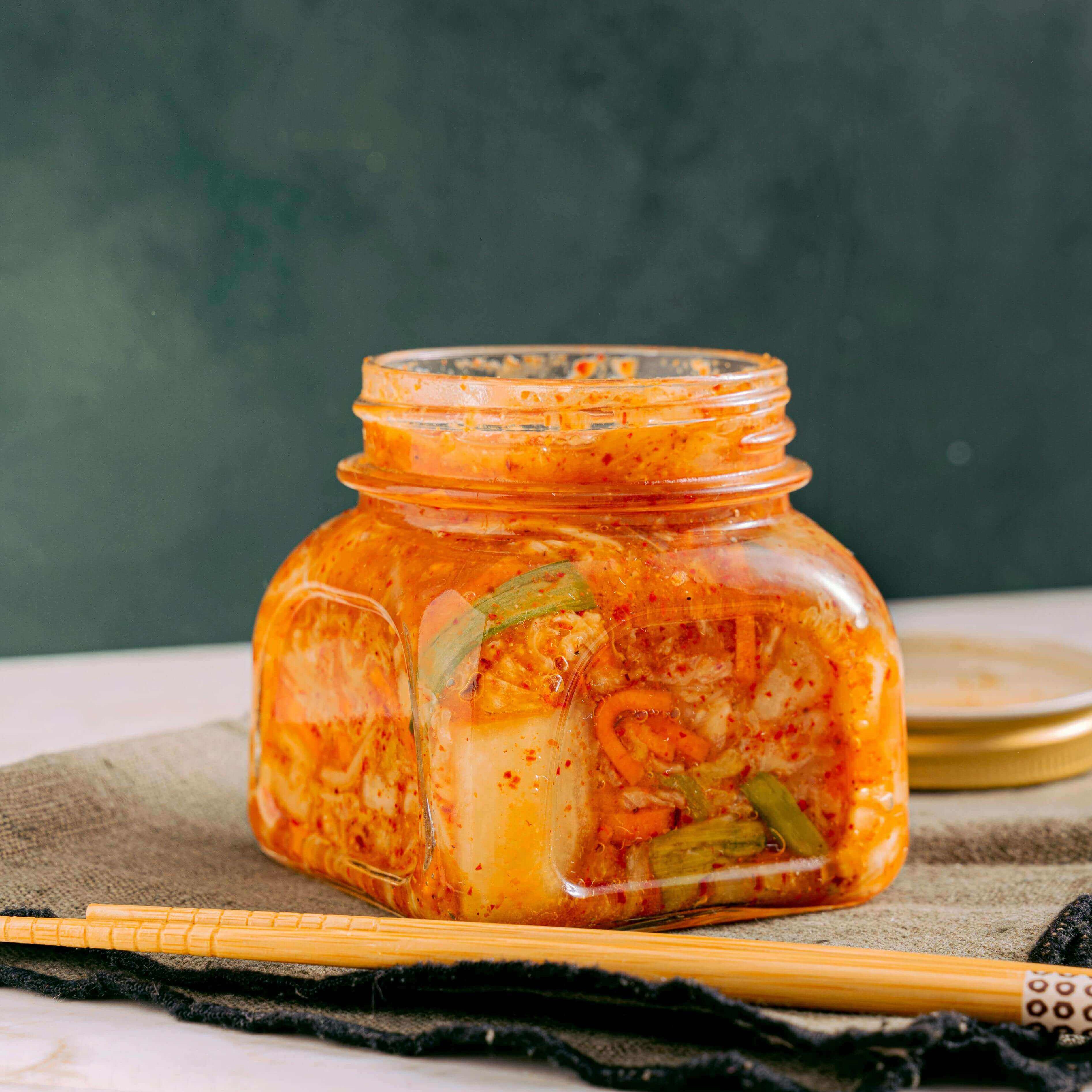 Image of a jar of kimchi, a fermented food supporting gut health, for an article on Why Gut Health Matters and How to Support It - Windback NZ.