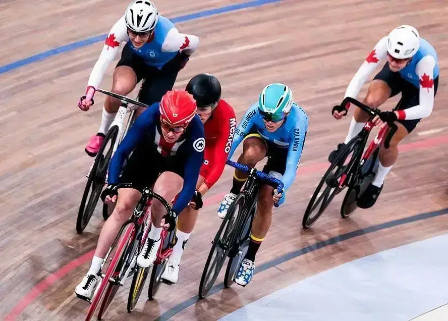 Cyclists racing on a velodrome track during a competitive cycling event - Windback NZ