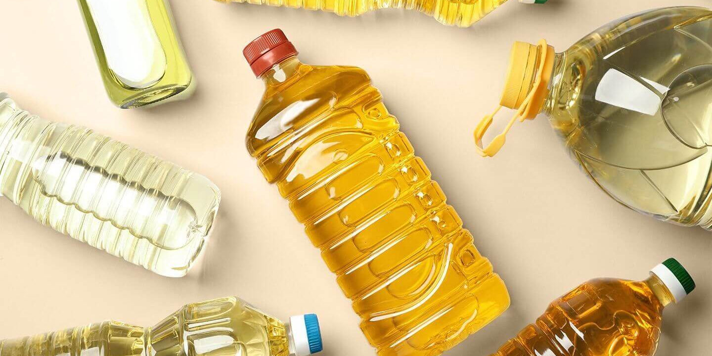 Seed oils in real life: What to avoid, what to use, and why it matters - various bottles of seed oils on a flat surface.