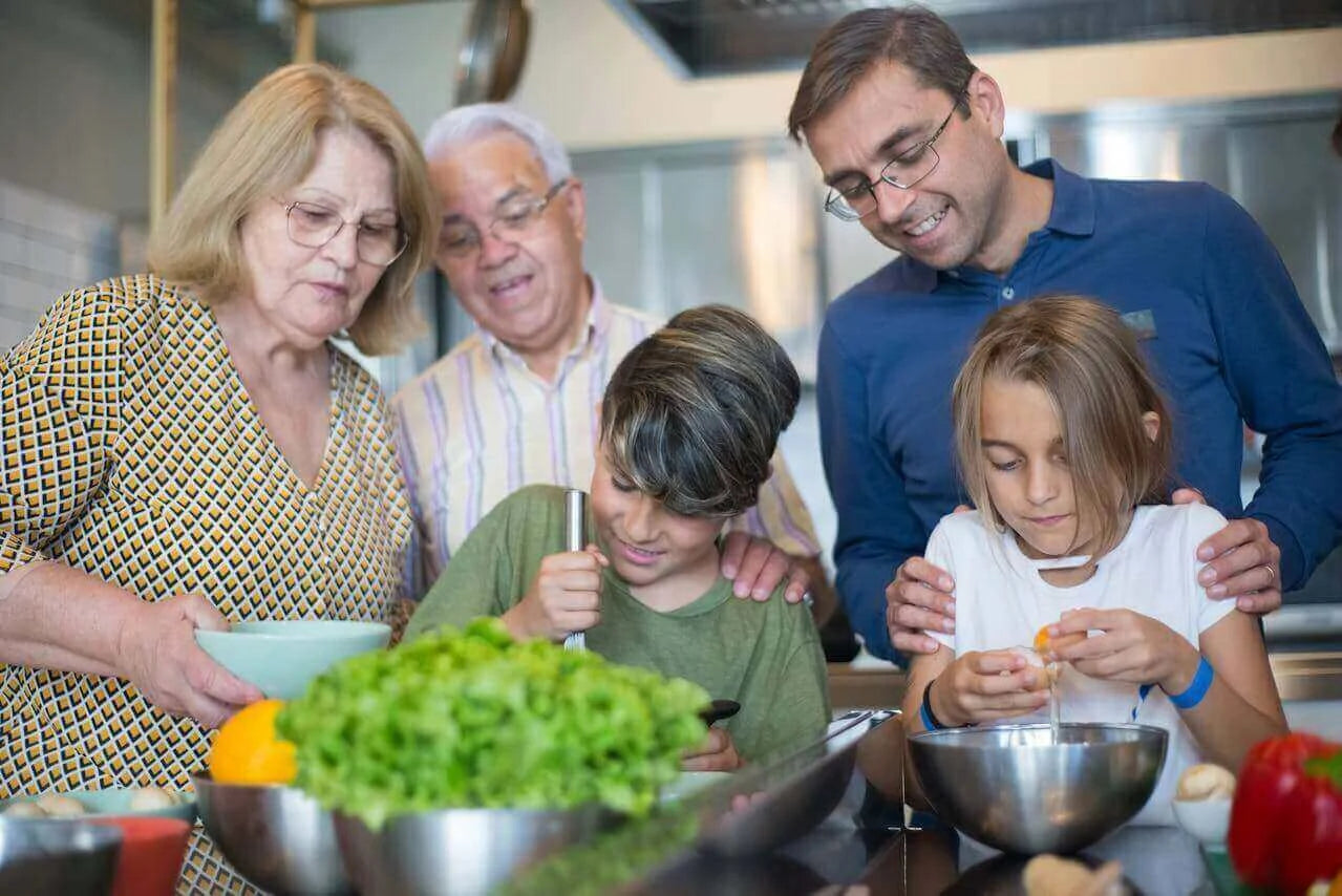 Family cooking together in the kitchen, showcasing the best diet is the one that survives real life.