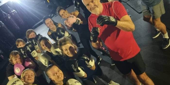 Group exercising together to promote Brain Health & Exercise for improved memory and focus.