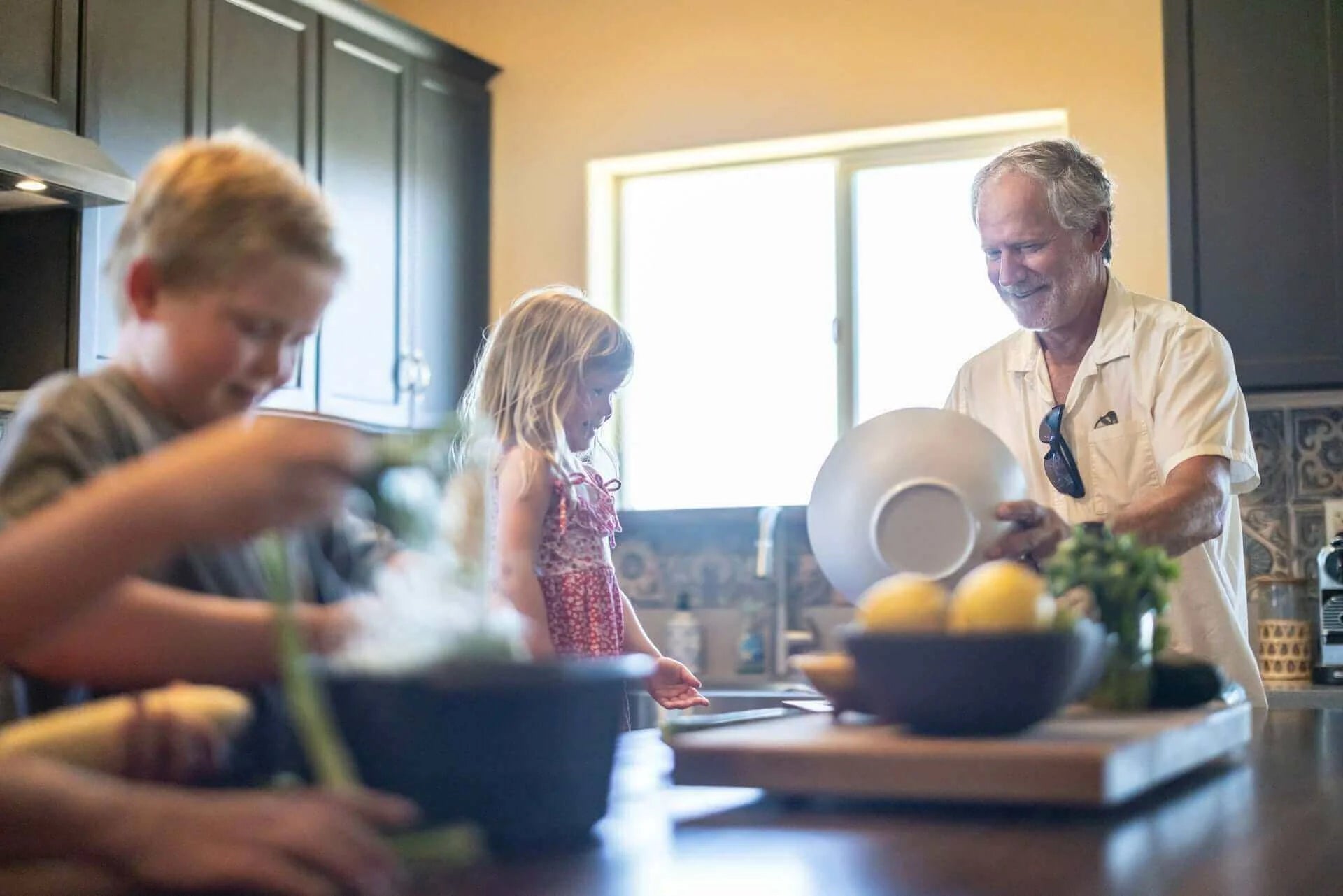 Food First Then Supplements: “I Eat Well – So Why Would I Need Supplements?” Family cooking together in a kitchen.