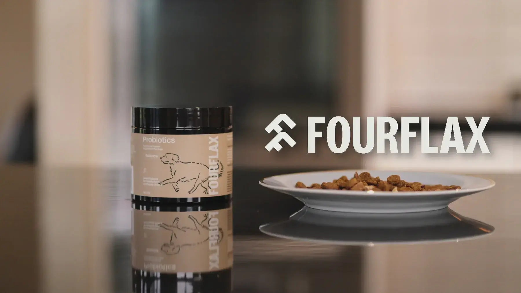 Fourflax pet food packaging on a table with a blurred background
