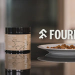 Fourflax pet food packaging on a table with a blurred background