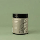 Container of FourFlax Flax Seed Flake on a green background