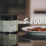 Fourflax multivitamin container on a kitchen counter with a blurred background