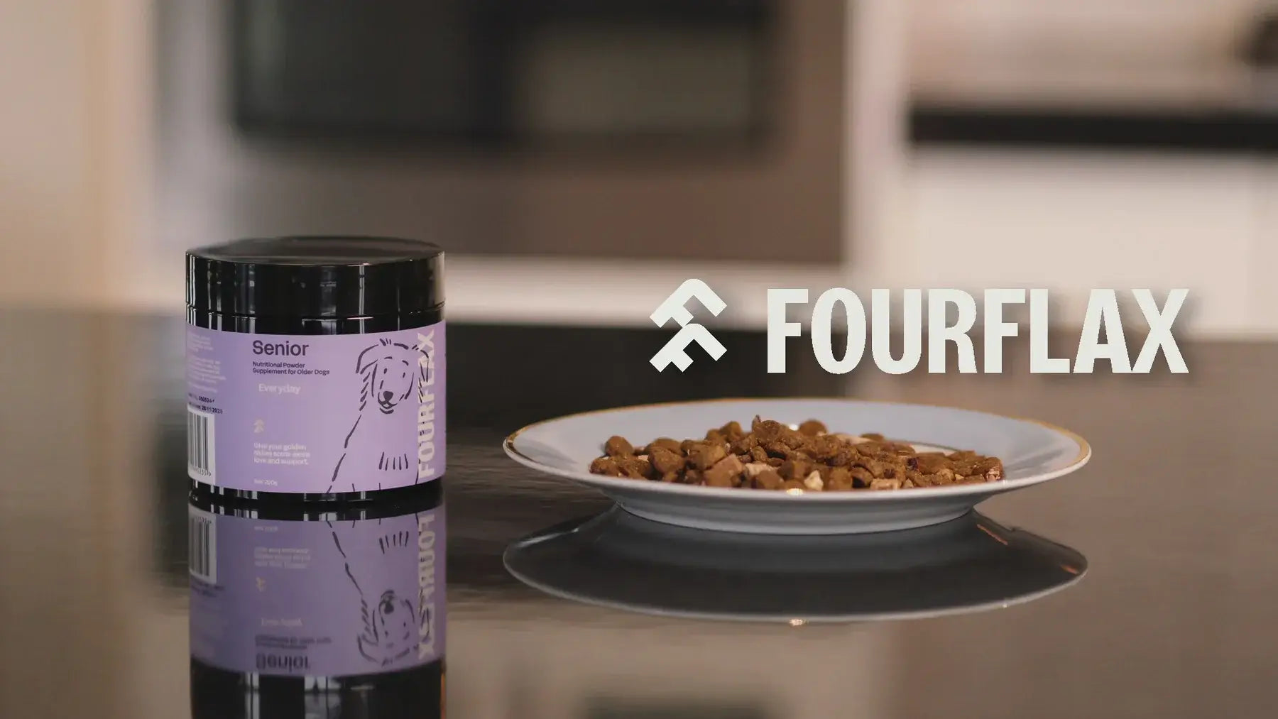 Fourflax pet food container and plate with food on a kitchen counter