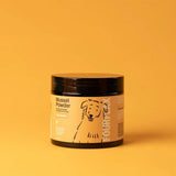 Jar of mussel powder with a label on an orange background