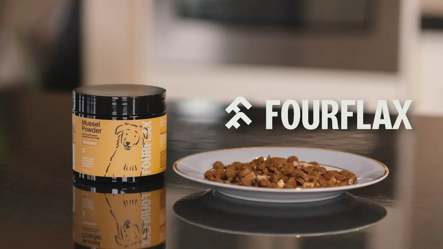 Fourflax almond powder container and a plate of almond-flavored dog food on a reflective surface.