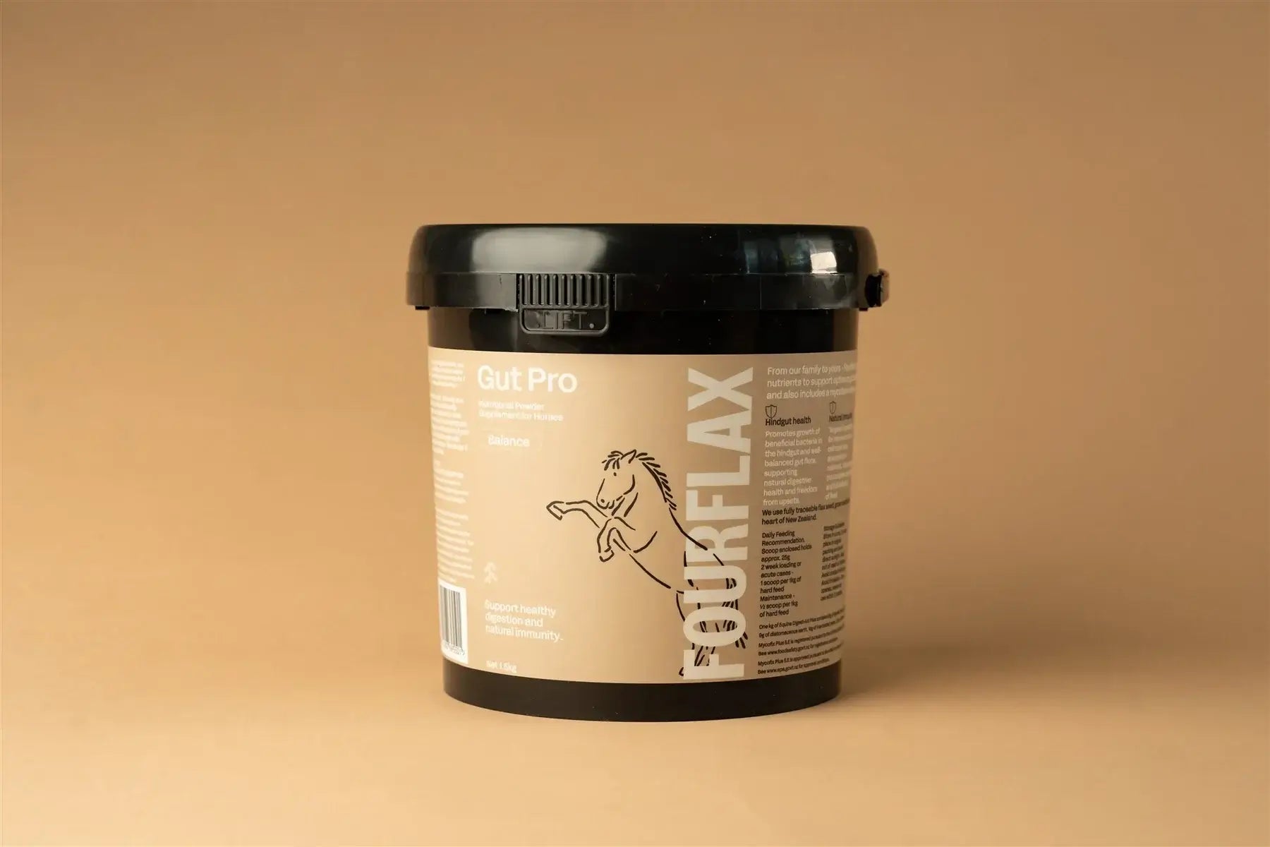 FourFlax Gut Pro supplement container on a beige background
