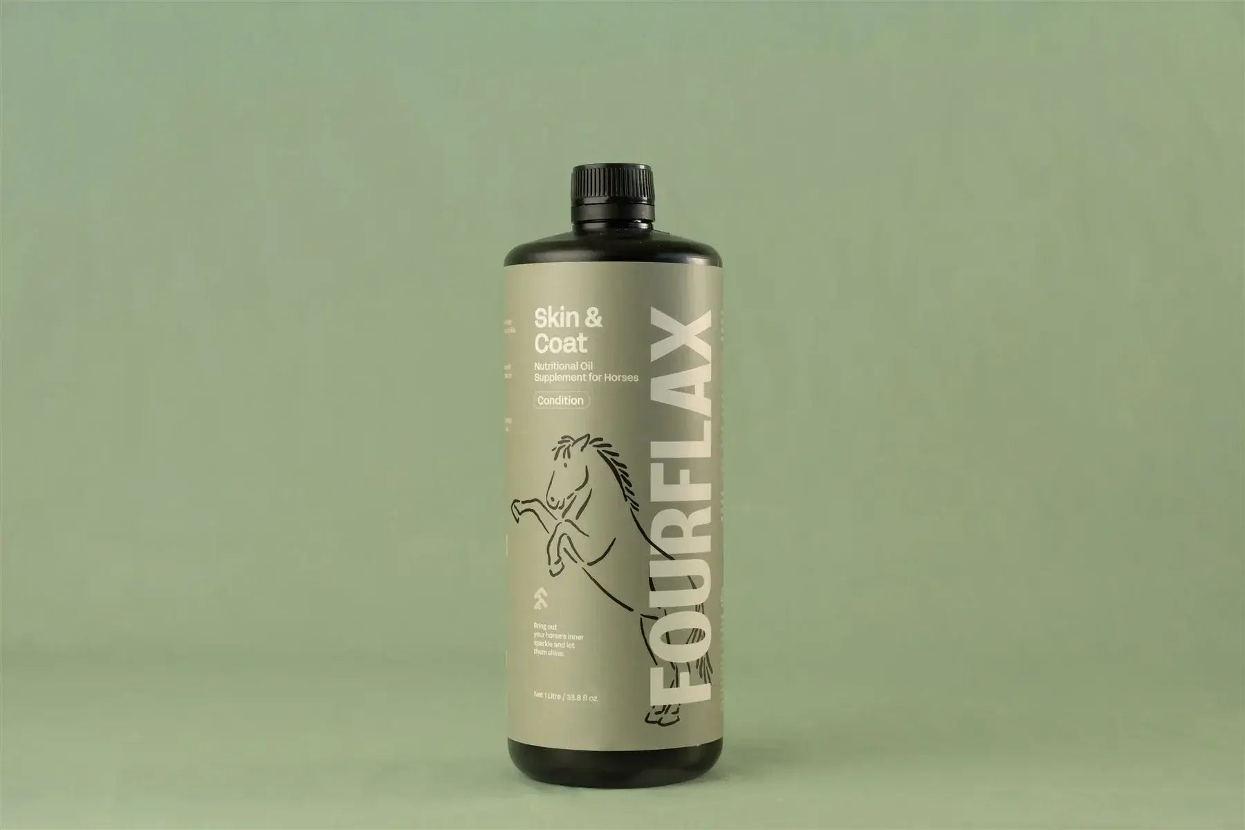 Bottle of FourFlax Skin & Coat supplement on a green background