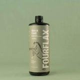 Bottle of FourFlax Skin & Coat supplement on a green background