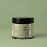 Jar labeled 'Multivits' and 'FourFlax' on a green background