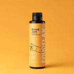 Bottle of Fourflax Bone & Joint supplement for cats on a yellow background
