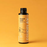 Bottle of Fourflax Bone & Joint supplement for cats on a yellow background