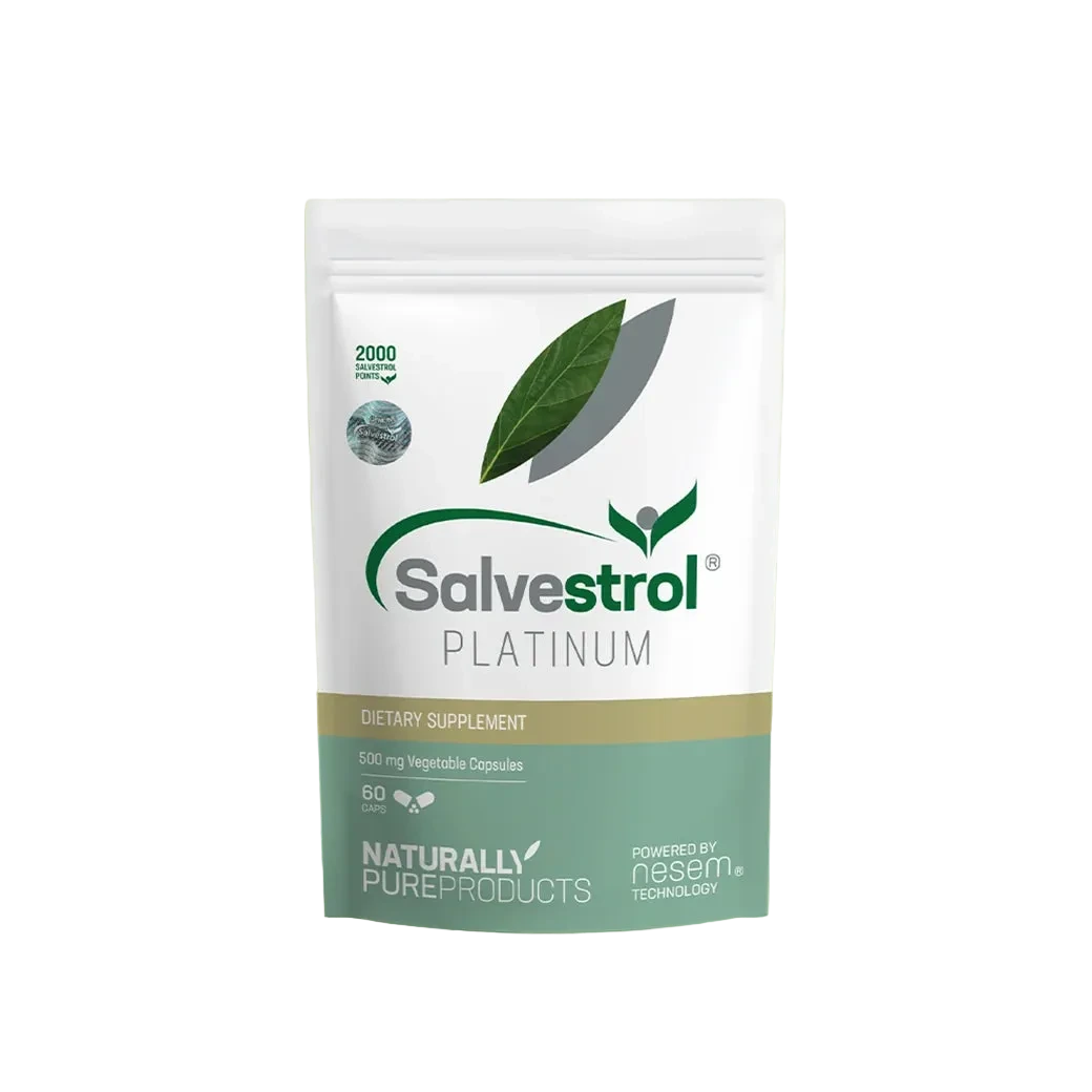 A white stand-up pouch of Salvestrol Platinum dietary supplement, featuring green leaf graphics and a gold and teal band near the bottom, centered on a pale green background.